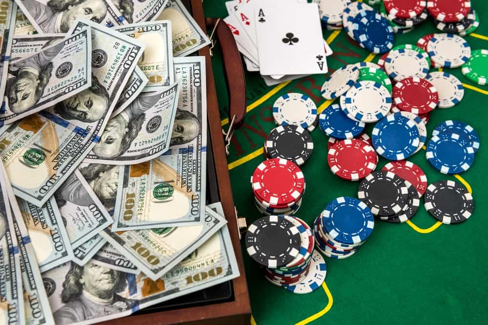 Wooden case for poker chips with playing cards and American dollars
