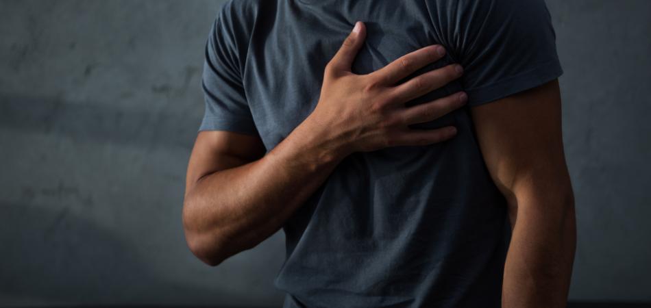 Chest Pain After Drinking Alcohol Man Holding Chest